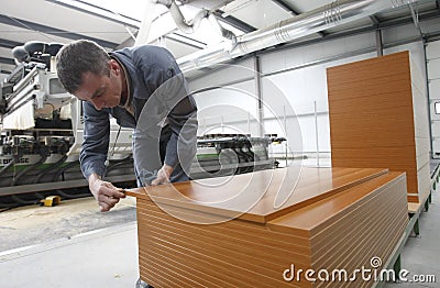 Worker in furniture factory