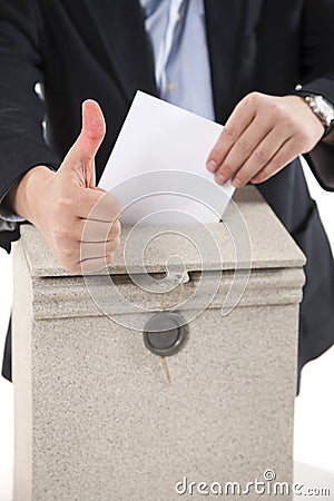 Worker putting letter in mailbox,showing thumbs up gesture