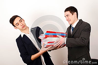 Worker receiving many files from his happy boss.