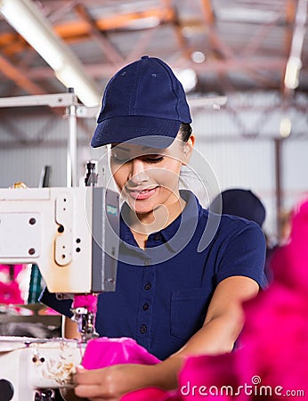 Worker sewing garment