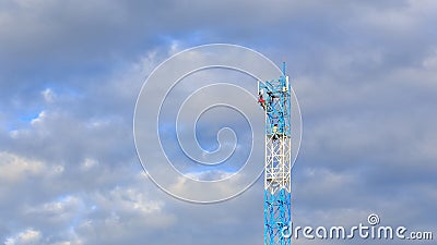 Worker working on communication tower