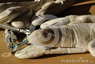 Workers gloves and screws