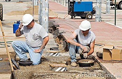 Workers Installing Lights