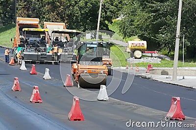 Workers laid asphalt on road