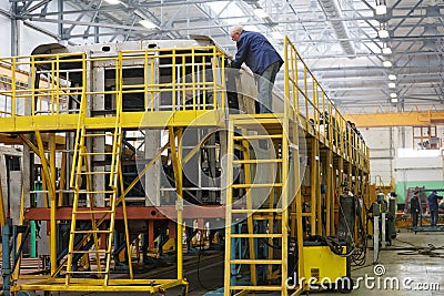 Workers on stocks in shop floor