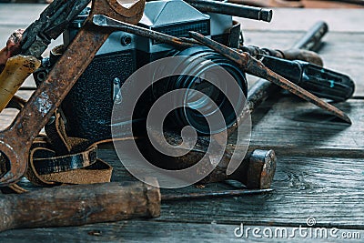 Working tools and vintage photo camera