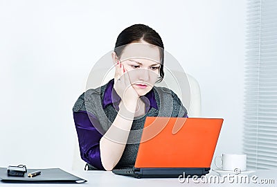 Worried business woman using laptop