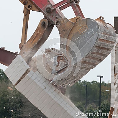Wreck excavator at work demolishing