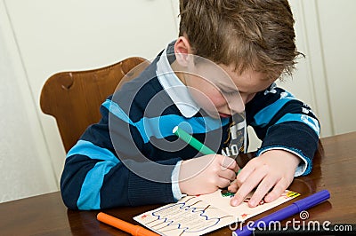 Writing And Drawing Boy