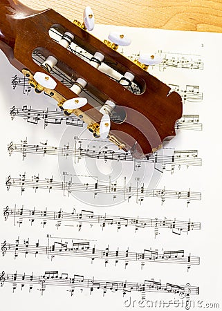 Written sheet music and a stringed instrument