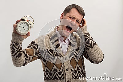 Yelling man with alarm clock in hand