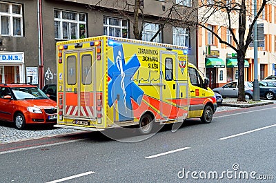 Yellow ambulance car on the street in Prague