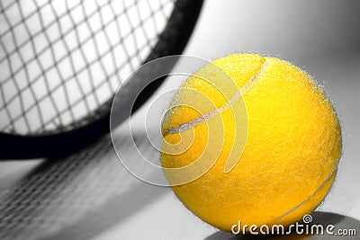 Yellow Felt Tennis Ball and Sport Racket