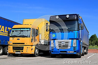 Yellow Ford Cargo 1830 and Renault Magnum Semi Trucks