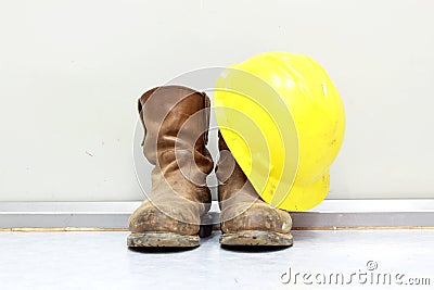 Yellow hard hat and boots