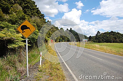Yellow kiwi bird road sign at roadside