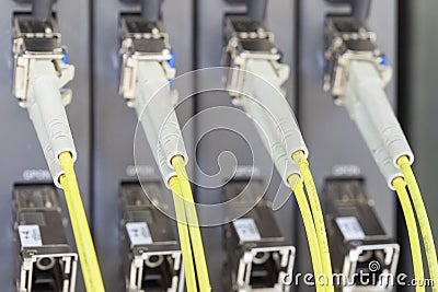 Yellow optic fiber connected to switch