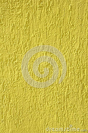 Yellow relief plaster on wall closeup