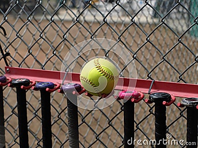 Yellow Softball and Bats