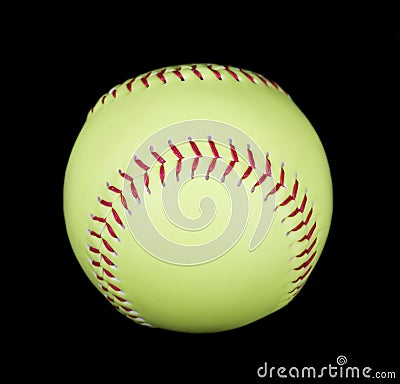 Yellow softball on black