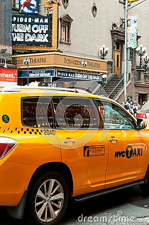 Yellow taxi cab on 42nd street in New York City