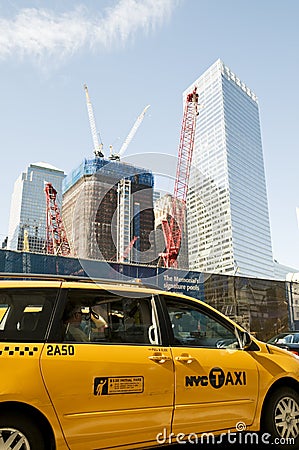 Yellow taxi cab in front of 9/11 Memorial cite