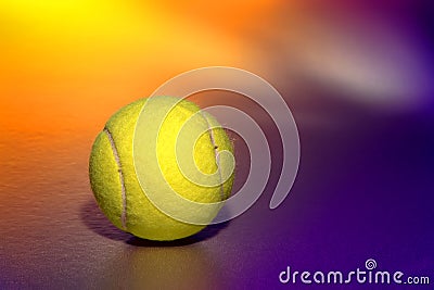 Yellow Tennis Sport Ball over Purple Background