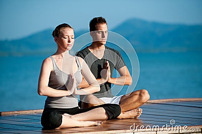 Yoga Couple By Ocean