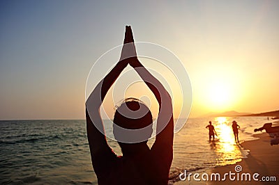 Yoga woman meditation at sunrise seaside