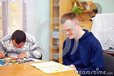 Young adult man engages in self study, in rehabilitation center