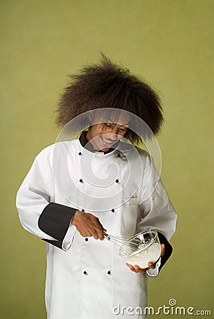 Young African American Chef Whisking Cream