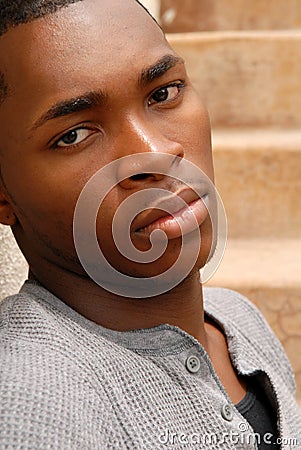 Young African American man with a sad expression
