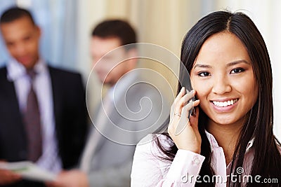 Young asian businesswoman on phone