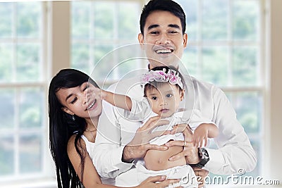 Young asian family in new home