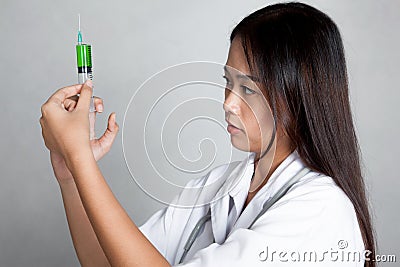 Young Asian female doctor check syringe