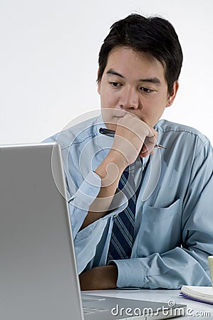 Young Asian male with computer