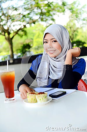 Young asian muslim woman in head scarf