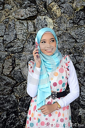 Young asian muslim woman in head scarf