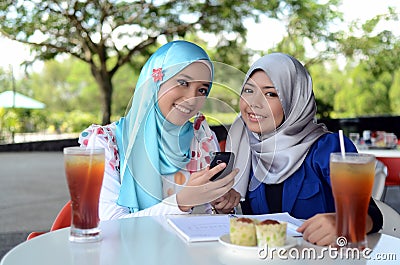 Young asian muslim woman in head scarf