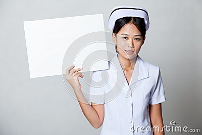 Young Asian nurse show blank sign on her shoulder