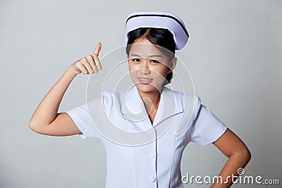 Young Asian nurse show thumbs up