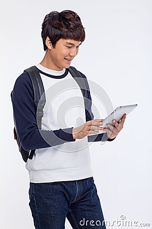 Young Asian student using pad PC