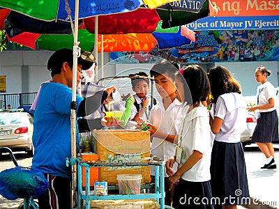 Young asian students buying food