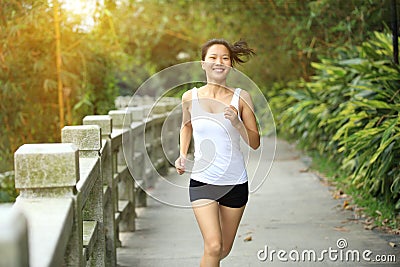 Healthy lifestyle young asian woman jogging at park.