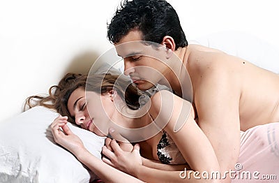 Young attractive couple in bedroom