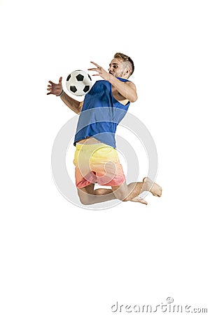 Young attractive guy playing with football isolated on white background