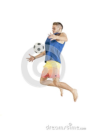 Young attractive guy playing with football isolated on white background