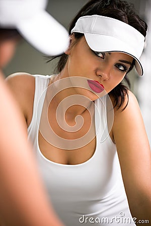 Young attractive woman reflected in the mirror