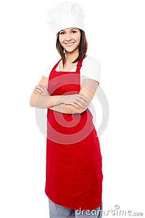 Young baker woman with folded arms