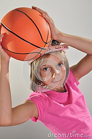 Young basketball player makes a throw